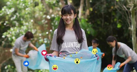 Asian volunteers cleaning park litter with blue bags, gloves and social media reactions