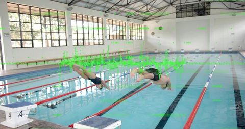 Competitive swimmers diving into pool with trajectory markers