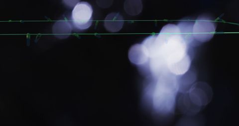 Enchanted Flickering Fairy Lights Amidst Glowing Abstract Background