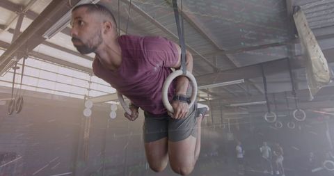 Man Training on Gym Rings with Digital Interface Overlay - Download Free Stock Images Pikwizard.com