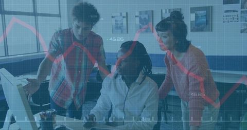 Team Analyzing Data Trends in Modern Office Environment