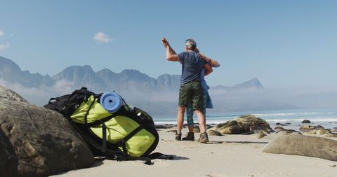 Happy Senior Couple Enjoying Dance on Scenic Beach