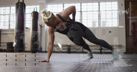 Woman holding side plank at gym with hud fitness data overlay, core strength workout