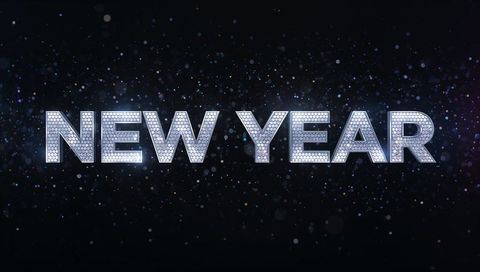 Glittering NEW YEAR Mosaic Typography with Bokeh Lights Metallic Glow for Celebration