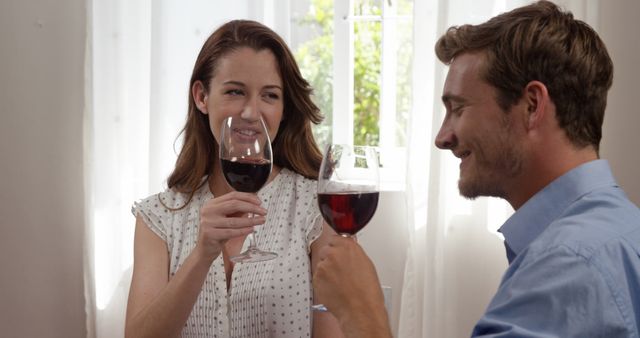 Couple Enjoying Red Wine in Romantic Setting at Home - Download Free Stock Images Pikwizard.com