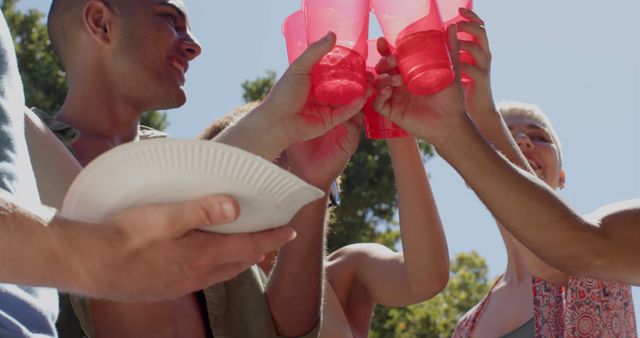 Group of Friends Making a Toast with Red Cups Outdoors in Sunlight - Download Free Stock Images Pikwizard.com