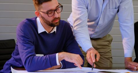 Professionals Conducting Strategic Business Review at Meeting Table - Download Free Stock Images Pikwizard.com