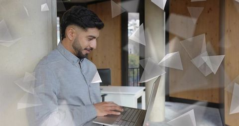 Business Professional Typing on Laptop in Modern Office Space