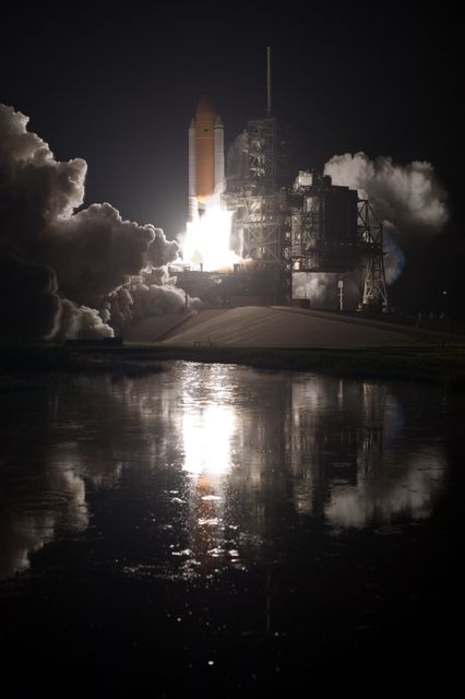 CAPE CANAVERAL, Fla. –  The water close to Launch Pad 39A at NASA's Kennedy Space Center in Florida captures the brilliance from launch of space shuttle Discovery on the STS-128 mission.  Liftoff from Launch Pad 39A was on time at 11:59 p.m. EDT. The first launch attempt on Aug. 24 was postponed due to unfavorable weather conditions.  The second attempt on Aug. 25 also was postponed due to an issue with a valve in space shuttle Discovery's main propulsion system.  The STS-128 mission is the 30th International Space Station assembly flight and the 128th space shuttle flight. The 13-day mission will deliver more than 7 tons of supplies, science racks and equipment, as well as additional environmental hardware to sustain six crew members on the International Space Station. The equipment includes a freezer to store research samples, a new sleeping compartment and the COLBERT treadmill.  Photo credit: NASA/Tony Gray-Tom Farrar