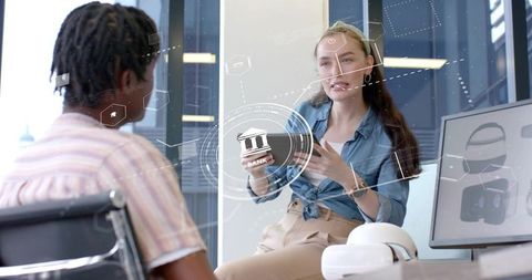 Female Engineer Demonstrating Holographic Banking Interface with Smartphone and VR Headset