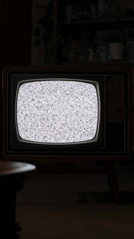 Switching Vintage CRT TV from Warm Glow into White Static Vertical Retro Living Room Video