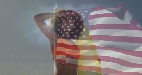 Confident Woman Under Sunlit Sky with American Flag Overlay