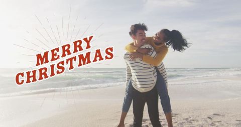 Joyful Couple Celebrating Christmas on Sandy Beach