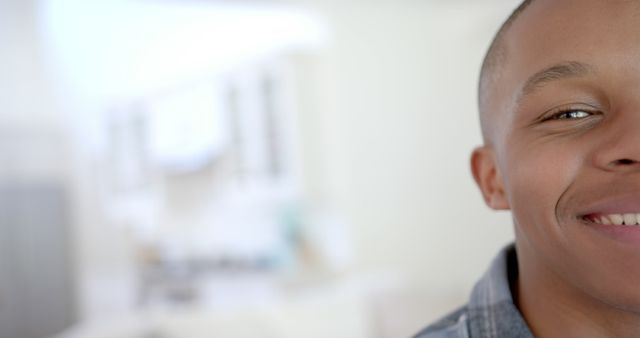 Close-Up of Smiling Young African American Man in Modern Home - Download Free Stock Images Pikwizard.com