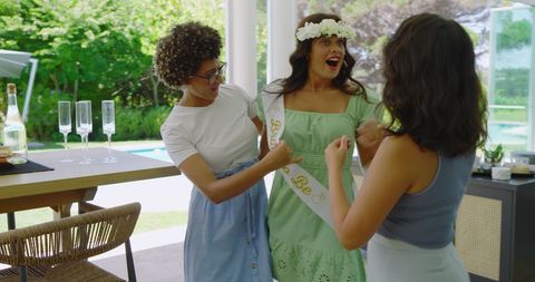 Joyful pre-wedding celebration with friends and bride-to-be