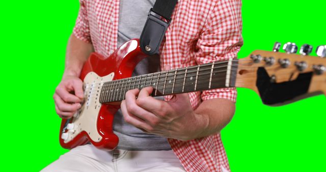 Person Playing Red Electric Guitar on Green Screen Background - Download Free Stock Images Pikwizard.com