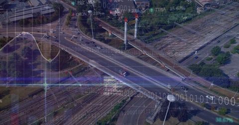 Aerial urban highway interchange with rail yard, bridge viaduct and digital data overlay