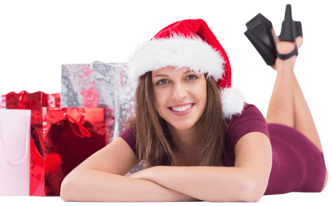 Festive Brunette in Santa Hat, Smiling with Transparent Gift Bags Background