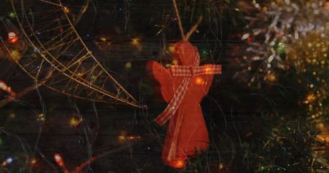 Festive Christmas Tree with Angel Ornament and Fairy Lights