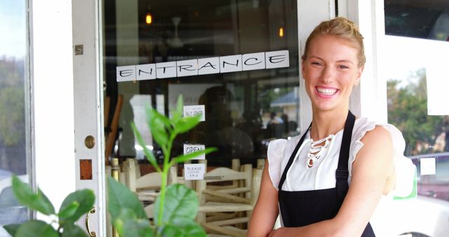 Smiling Waitress Standing Next to Closed Restaurant Entrance - Download Free Stock Images Pikwizard.com