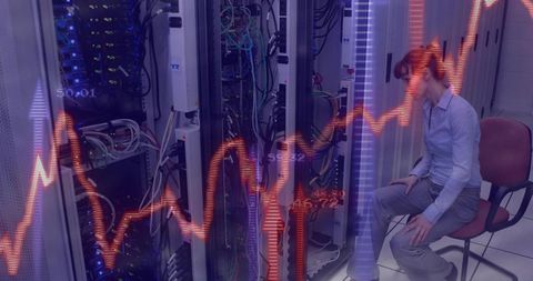 IT Technician Monitoring Server Racks and Network Cabling with Financial Data Overlay in Data Center