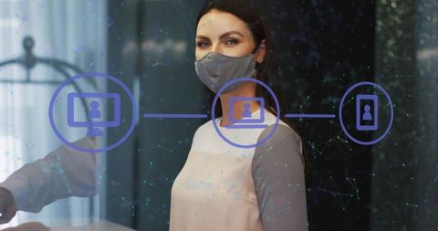 Masked receptionist behind glass partition with network overlay for contactless check-in