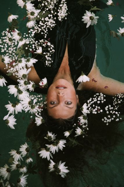 Woman Relaxing with Flowers Floating in Water - Download Free Stock Images Pikwizard.com