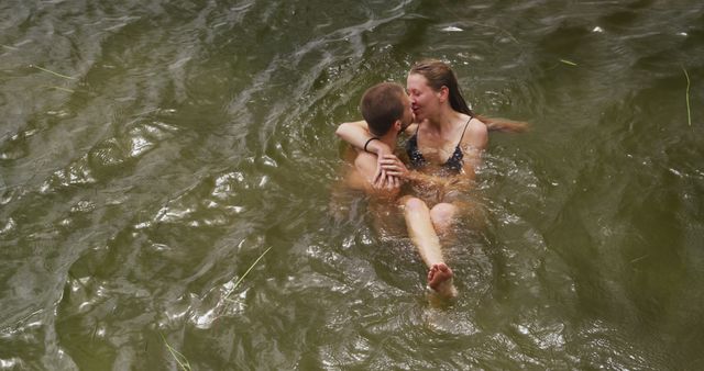 Couple Embracing While Swimming in Natural Lake - Download Free Stock Images Pikwizard.com