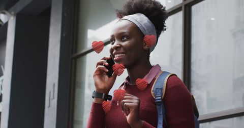 Happy woman talking on phone in urban environment