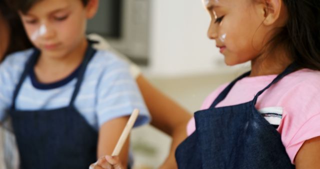 Children Cooking Together Wearing Aprons in Kitchen - Download Free Stock Images Pikwizard.com