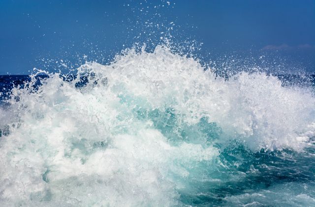 Powerful Ocean Wave Crashing Against Blue Sky - Download Free Stock Photos Pikwizard.com