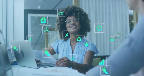 Diverse Business Professionals Embracing Eco-Friendly Technology