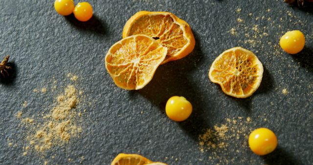 Dried Citrus Slices and Yellow Berries on Dark Slate Background - Download Free Stock Images Pikwizard.com