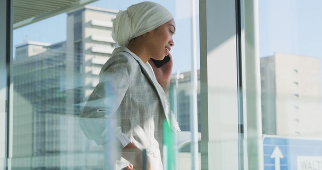 Businesswoman in Modern Office Building on Phone Call - Download Free Stock Images Pikwizard.com