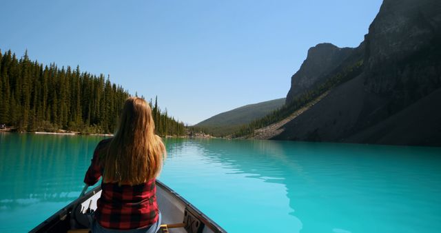 Woman Canoeing on Serene Mountain Lake - Download Free Stock Photos Pikwizard.com