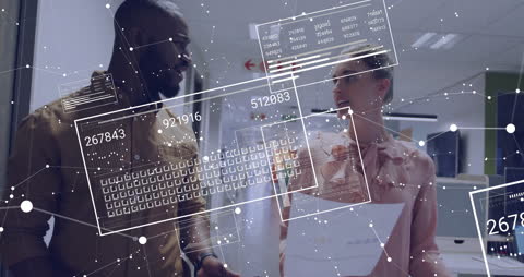 Diverse Professionals Analyzing Data Graphics in Modern Office