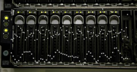 Rack server drive bay with hot-swap caddies and yellow status leds in data center