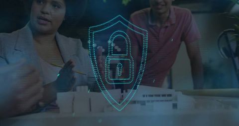 Team discussing cybersecurity for architectural design with holographic shield lock