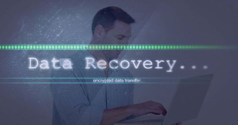 Businessman Recovering Encrypted Data on Laptop with Futuristic Holographic Cybersecurity Interface