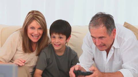 Multigenerational Family Enjoying Playtime on Couch