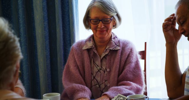 Senior Women Playing Cards with Friends at Retirement Home - Download Free Stock Images Pikwizard.com