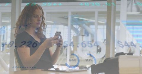 Business professional monitoring financial analytics in office