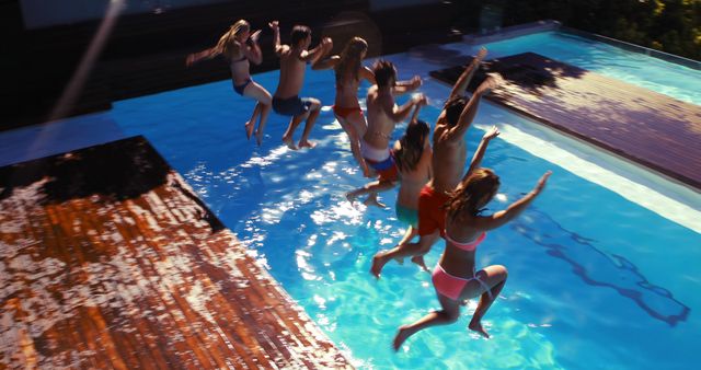 Group of Friends Jumping into Pool Enjoying Summer Vacation - Download Free Stock Images Pikwizard.com