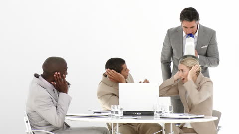 Confident Businessman Using Megaphone in Successful Team Meeting
