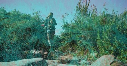 Adventure duo hiking rocky trail with backpacks and water bottle, textured teal overlay