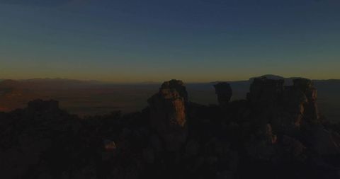 Dramatic Twilight View of Rock Pillars on Desert Plateau