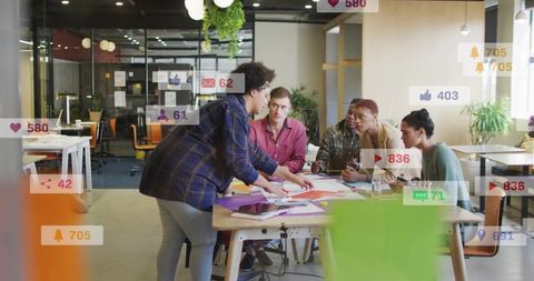 Diverse team collaborating and brainstorming at modern office with social media overlays