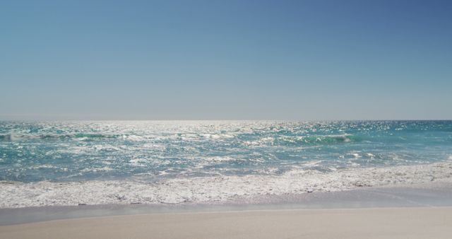 Peaceful Ocean Waves on Sunny Beach - Download Free Stock Images Pikwizard.com