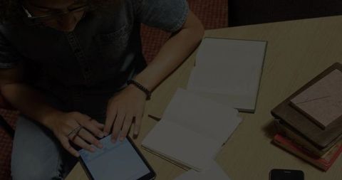 Technology and Learning in Workspace with Denim Shirt Man