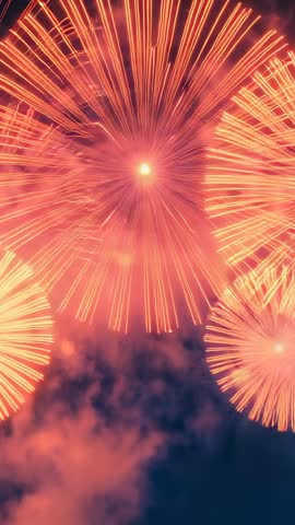 Vertical Fireworks Spectacle: Aerial Shells Bursting with Golden Chrysanthemum Trails